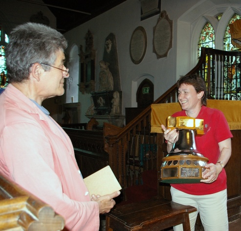 Anne Bray accepts 6-bell trophy on behalf of Kirby-le-Soken